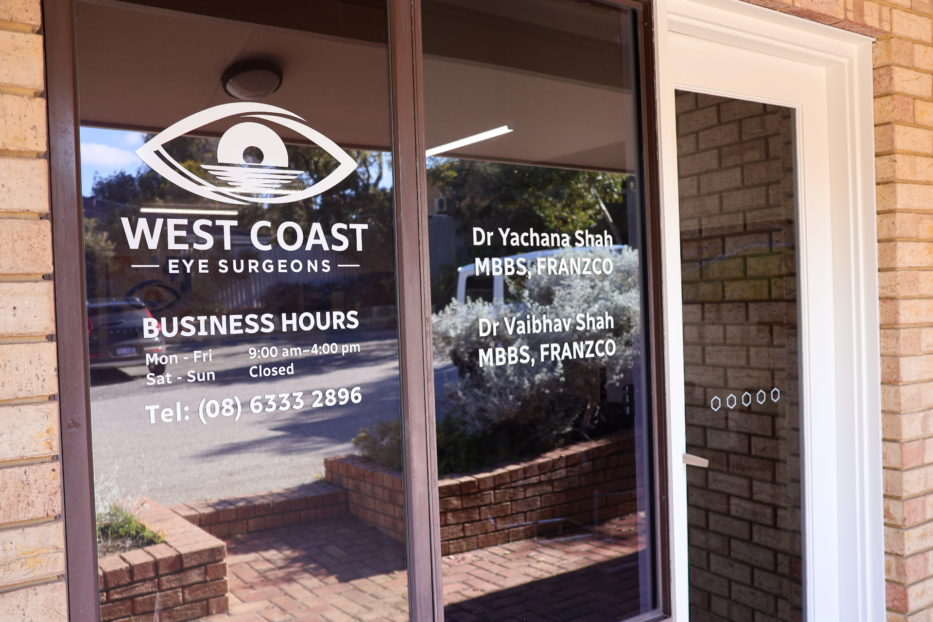 Front entry window showing practice branding and surgeon names